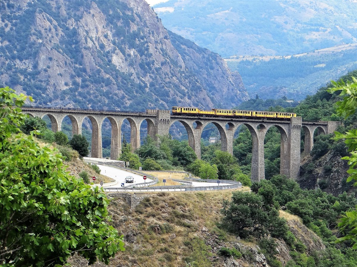 The Yellow Train crossing the Séjourné viaduct at Fontpédrouse
